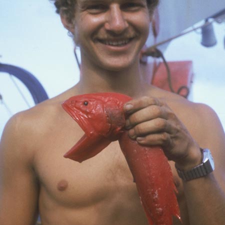 Robert Kieckhefer holding whalefish (Barbourisia rufa) in midwater trawl, Indopac Expedition. August 3, 1976