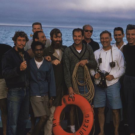 A few members of the R/V Argo crew, scientists, and other representatives from the Scripps Institution of Oceanography's Swan Song Expedition (1961), (left to right in front row only) unidentified, Robert S. Kiwala; C. Balarama Murty; Finn E. Bronner; unidentified; James M. Frey; and John Atkinson Knauss. December 1, 1961.