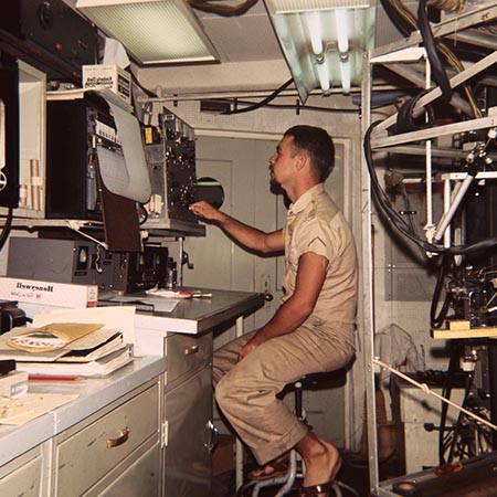 Unidentified scientist is shown here on watch on the research ship Argo during the Lusiad Expedition (1962-63). This expedition was an international effort to explore the Indian Ocean. On this expedition, the Scripps Institution of Oceanography research vessels Horizon and Argo sailed around the world to study the Indian Ocean, its currents and map its seafloor. Circa 1963.